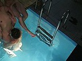 Spying in sauna is always worth the efforts! Enjoy the wild fuck session in the pool with the guy supporting lustful naked bimbo when his ally is wildly pumping her snatch with water slopping inside the hole!