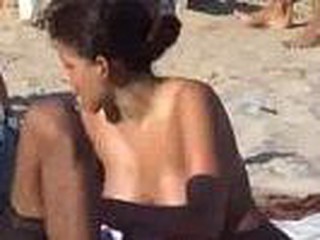 Hot latina spied on beach with hidden cam, precious looking hotty with lovely big boobies sitting down, she gets up and quick glimpse of pussy, hawt bitch.