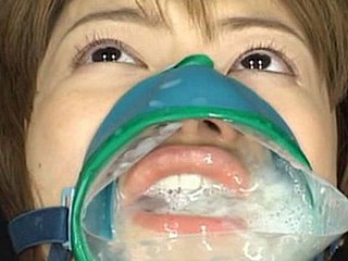 Ruri Anno is fastened down and takes cumshots into this cum facial mask over her face hole and nose.