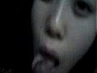 Grainy but very lifelike trickled private video of a Korean GF blowing a firm cock kneeling in an unlit room and occasionally checking out her lovers face for signs of pleasure.